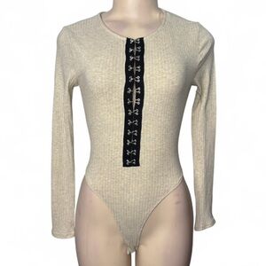 A3 Design Cream Ribbed Long-Sleeve Bodysuit with Black Hook Front